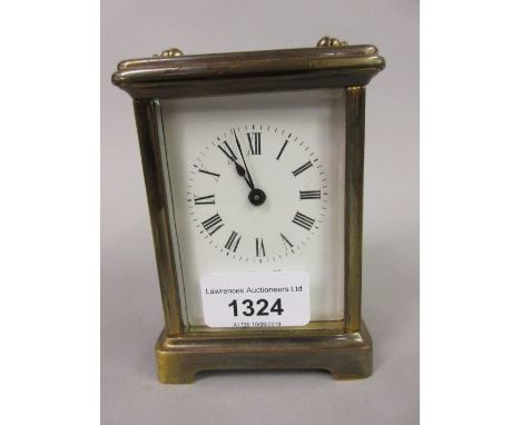 20th Century brass cased carriage clock having enamel dial with Roman numerals including winding key, 4.25ins high, 3.25ins w