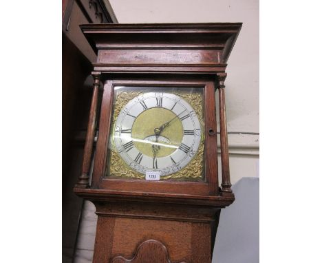 18th Century oak longcase clock, the square hood with flanking pilasters above a star inlaid shaped moulded panelled door and