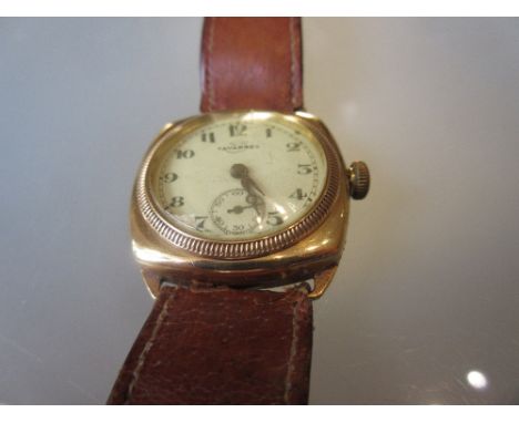 Gentleman's 18ct gold cased cushion shaped wristwatch by Tavannes, the enamel dial with Arabic numerals and subsidiary second