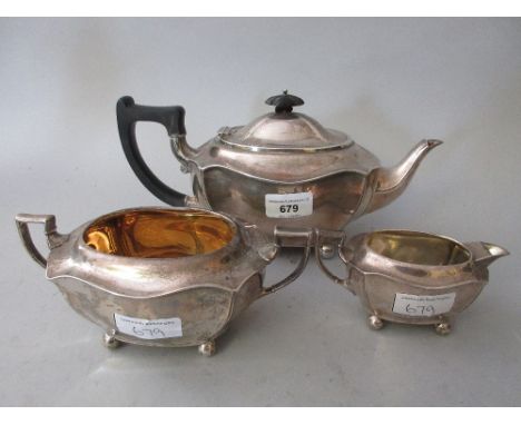 Sheffield silver three piece tea service, the teapot with ebony finial and handle 