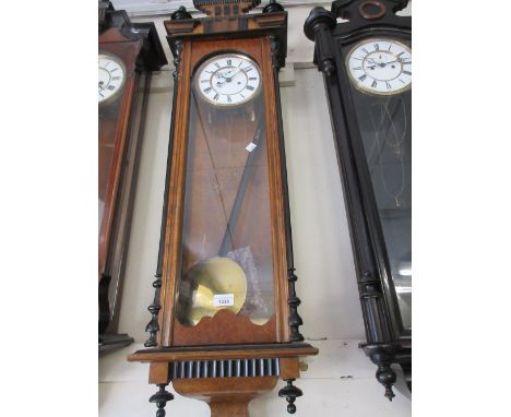 Burr walnut and ebonised Vienna style wall clock with circular enamel dial having Roman numerals, subsidiary seconds and two 
