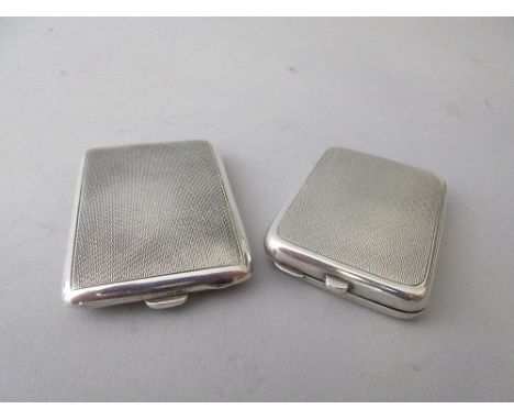 Two silver engine turned match book holders 