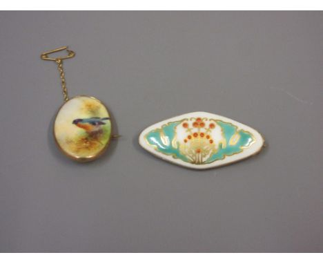 Two small Royal Worcester porcelain plaques in 9ct gold brooch mounts, one signedThe larger has had a repair to the gold.Pin 