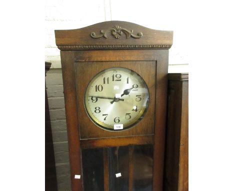 1930's Oak longcase clock, the circular silvered dial with Arabic numerals and three train weight driven movement 