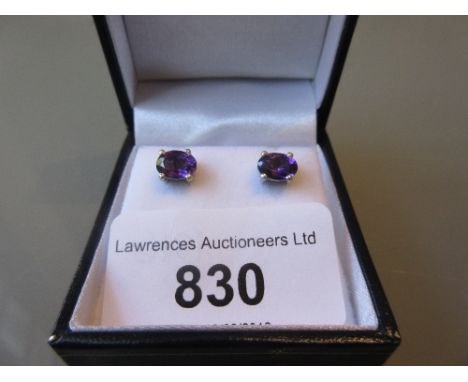 Pair of boxed amethyst ear studs 