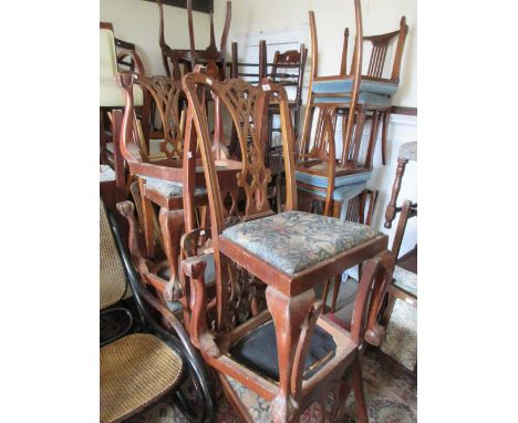 Set of eight mahogany Chippendale style dining chairs, the carved splat backs having floral upholstered drop-in seats, raised