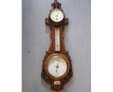 Late 19th / early 20th Century carved walnut cased three glass thermometer / barometer / clock, 26ins high 