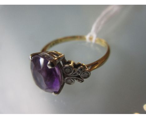 18ct Yellow gold ring set amethyst with diamond set shoulders 