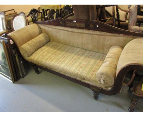 Regency mahogany and cut brass inlaid sofa raised on turned tapering front supports 