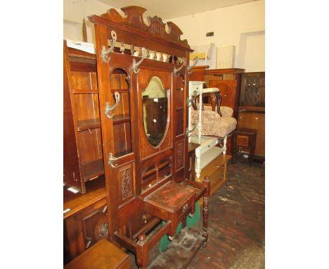 Large 19th Century mahogany hall stand having various hooks, glove drawer and twin stick stands (one hook at fault), 7ft high