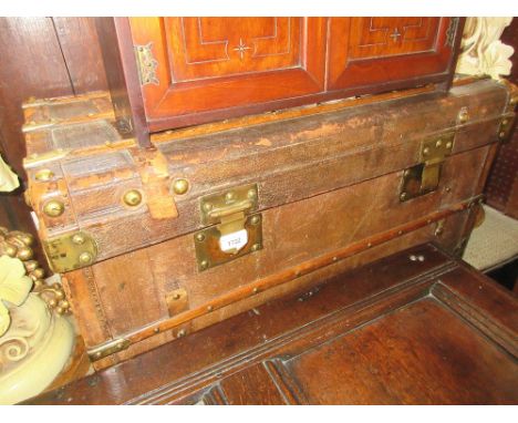 19th Century leather and wood banded trunk with brass fittings 
