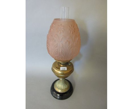 Victorian brass oil lamp with a pink frosted glass shade 