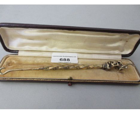 19th Century German silver (800 mark) gilt button hook with figural finial in original leather case 