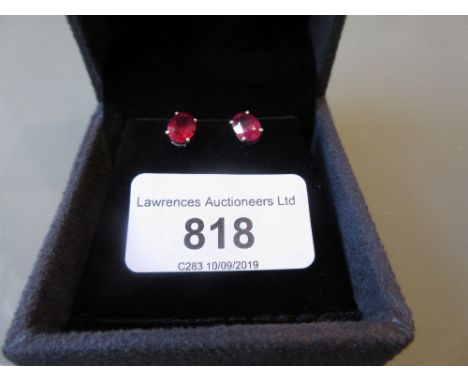 Pair of silver and treated ruby ear studs 