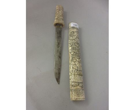 Japanese dagger, the bone grip and scabbard carved with various figures 