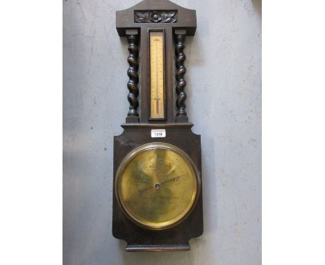 20th Century oak cased wheel barometer with barley twist decoration 