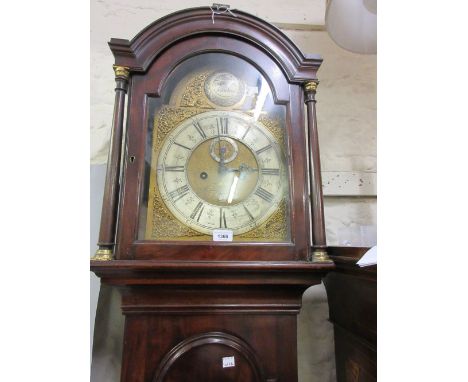 George III mahogany longcase clock, the arched hood flanked by turned columns above an arched door, the gilded and silvered d