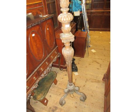 Early 20th Century carved walnut standard lamp on three C-scroll carved supports, 65ins high (for rewiring) 