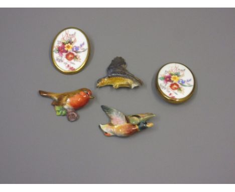Group of three Royal Worcester porcelain brooches in the form of a mallard, a robin and a sparrowhawk together with two Royal