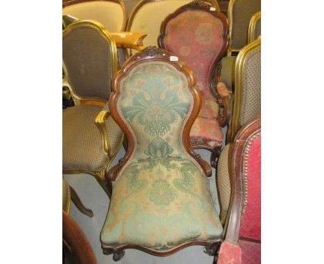 Pair of 19th Century walnut ' His and Hers ' drawing room spoon back chairs, having floral carved decoration with floral upho