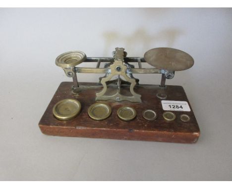 Pair of 19th Century brass and oak postal scales by S. Mordan and Co. 