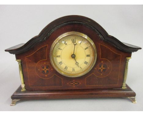 Edwardian mahogany marquetry inlaid dome top mantel clock, the dial with Roman numerals flanked by two brass columns 