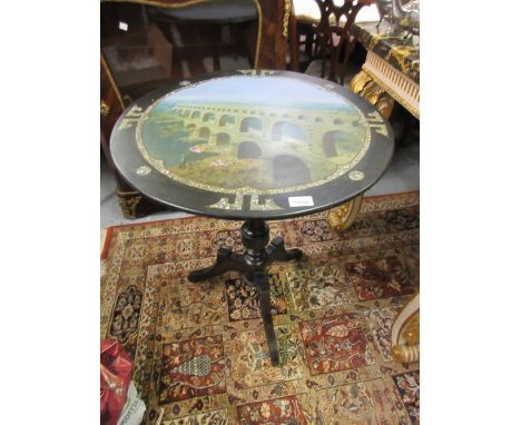 19th Century ebonised and papier mache circular tilt top pedestal table, the painted and abalone inlaid top decorated with a 