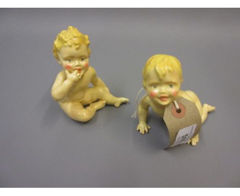 Two Royal Worcester porcelain prototype figures of children seated and crawlingNo back stamps.  Some minor loss of paint but 