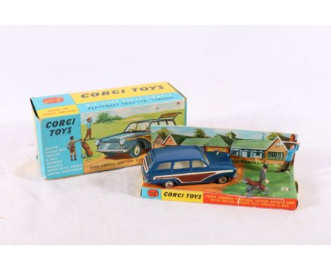 Corgi Toys 440 diecast Ford Consul Cortina Super Estate Car in metallic blue with figures of golfer and caddy with trolley, b