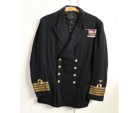 British Royal Navy dress uniform jacket having Gieves label "23.1.53 7087 K S Colquhoun, 2497 Mr J(P)", with brass naval butt