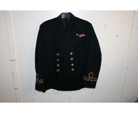 British Royal Navy dress uniform jacket having V H Bennett Ltd of Weymouth label "Lieut Walker RNVR 1/1/45", with brass naval