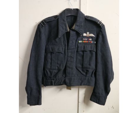 British Royal Air Force dress uniform jacket having L Harris Ltd label dated 1944 "War Service Dress Blouse Size 6", epaulett