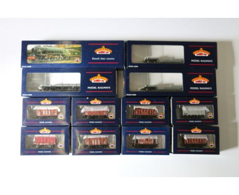 Bachmann Branchline OO gauge model railway rolling stock including 33856A Bolster wagon, two 33901C Well wagons, 37700A cattl