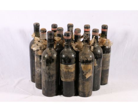 Twelve bottles of CHATEAU D'ISSAN Troisieme Grand Cru, no vintage stated, no abv or vol stated, condition is generally poor (