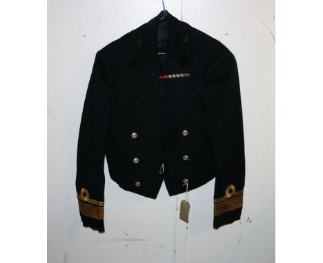 British Royal Navy dress uniform jacket having Gieves label "M 1-2-51 D A Dunbar-Nasmith", with brass naval buttons by Firmin