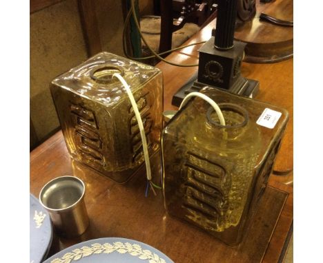 A pair of 1960's tinted glass light fittings with shades 
