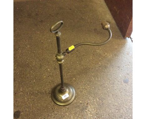 A brass adjustable desk lamp 