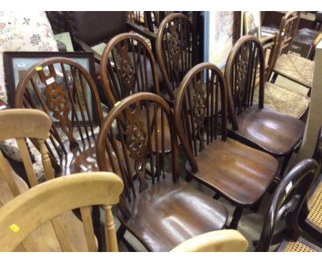 A set of six stick and wheelback dining chairs