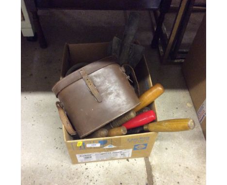 A box containing binoculars, hand tools, vice etc. 