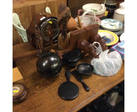 A bag of glass beads, a pair of wooden book ends, various wooden items to include an African figure, ebony dressing table ite