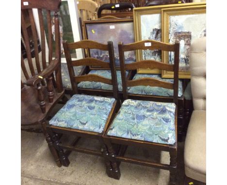 Four oak ladder back dining chairs