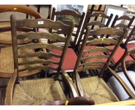A pair of oak ladder back and rush seated chairs 