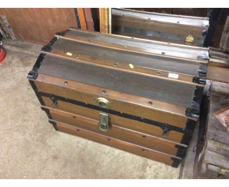 A wooden and metal bound dome topped trunk 