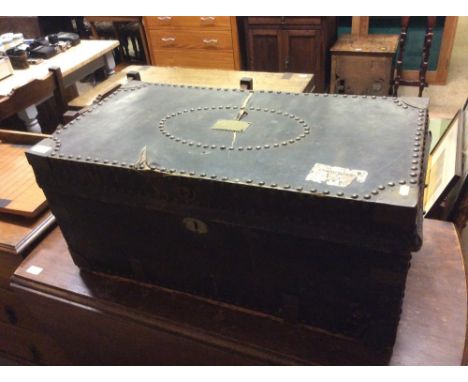 An antique leather and brass studwork decorated trunk with plaque "Mrs Kendall"