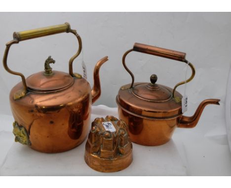 2 Copper Kettles (1 with horse head finial) & a copper jelly mould (3)