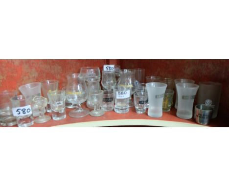 Shelf of bar shot glasses – Carolans, Smirnoff etc &amp; a small box of coloured chemist bottles