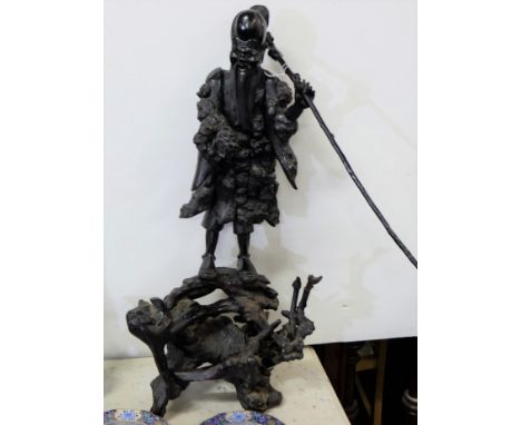 Chinese Carved Root Figure of a man with hand lamp and staff, an original base in the form of a tree roots, 36” h  