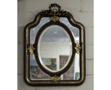 Ornate Gilt framed mirror – a floral swag finial over an oval mirror insert bordered by a gold and painted green frame, 41”w 
