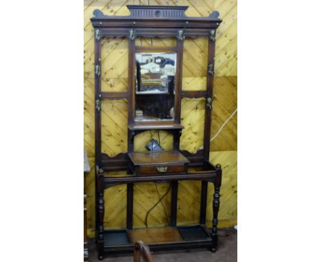 Edw. Walnut Hall Stand with a bevelled mirror insert, two stick stands and a drawer, fine brass hanging hooks, 85”h x 42”w