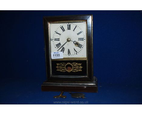 A wooden cased Mantle Clock with small etched glass panel. Key and pendulum.